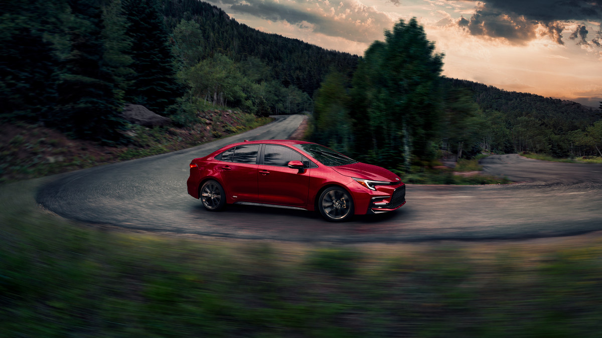 Toyota Corolla Hybrid SE AWD in Ruby Flare Pearl, options shown